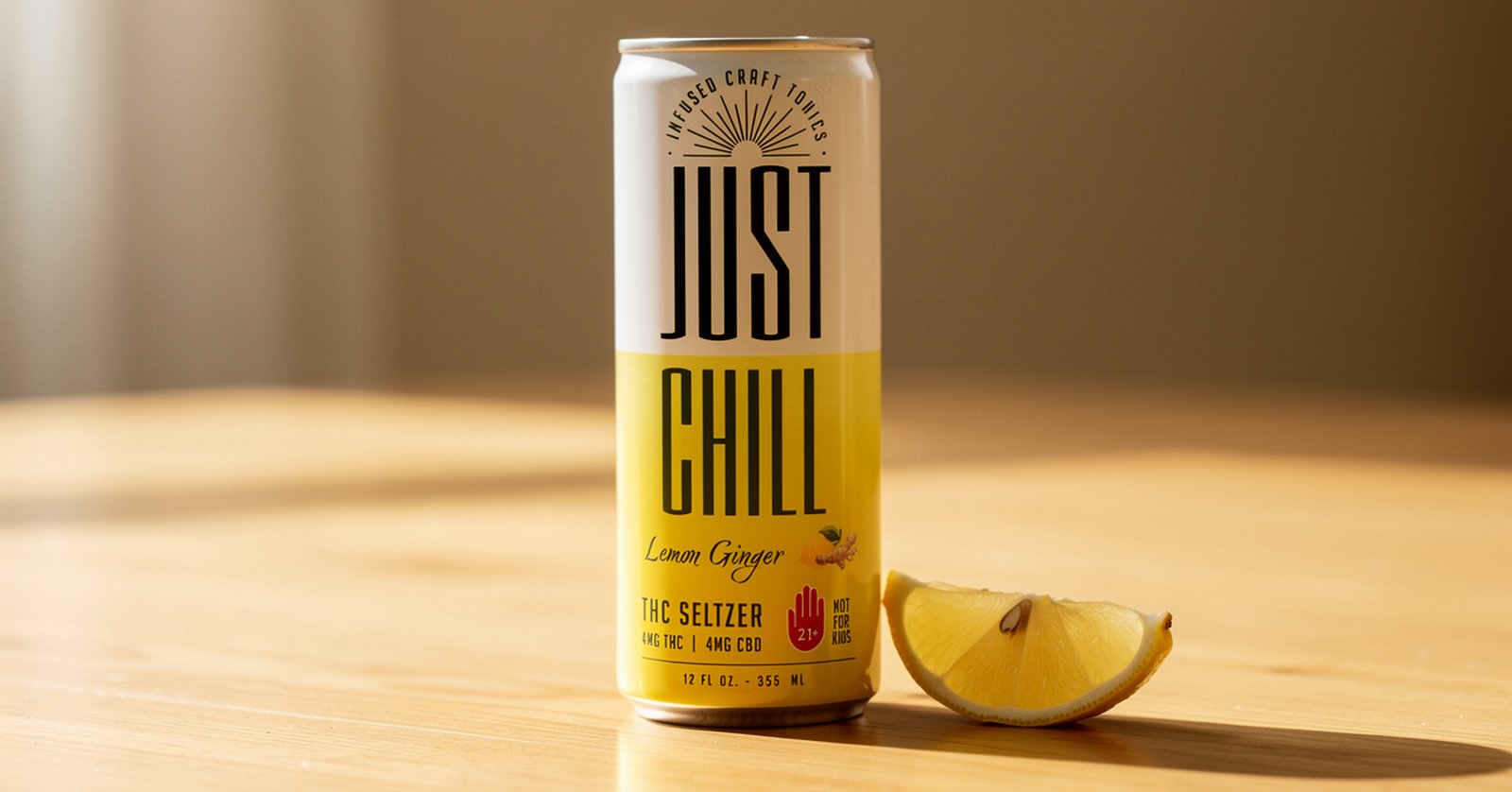 Just Chill Lemon Ginger 4mg THC and 4mg CBD craft tonic can with a lemon wedge on a wooden table