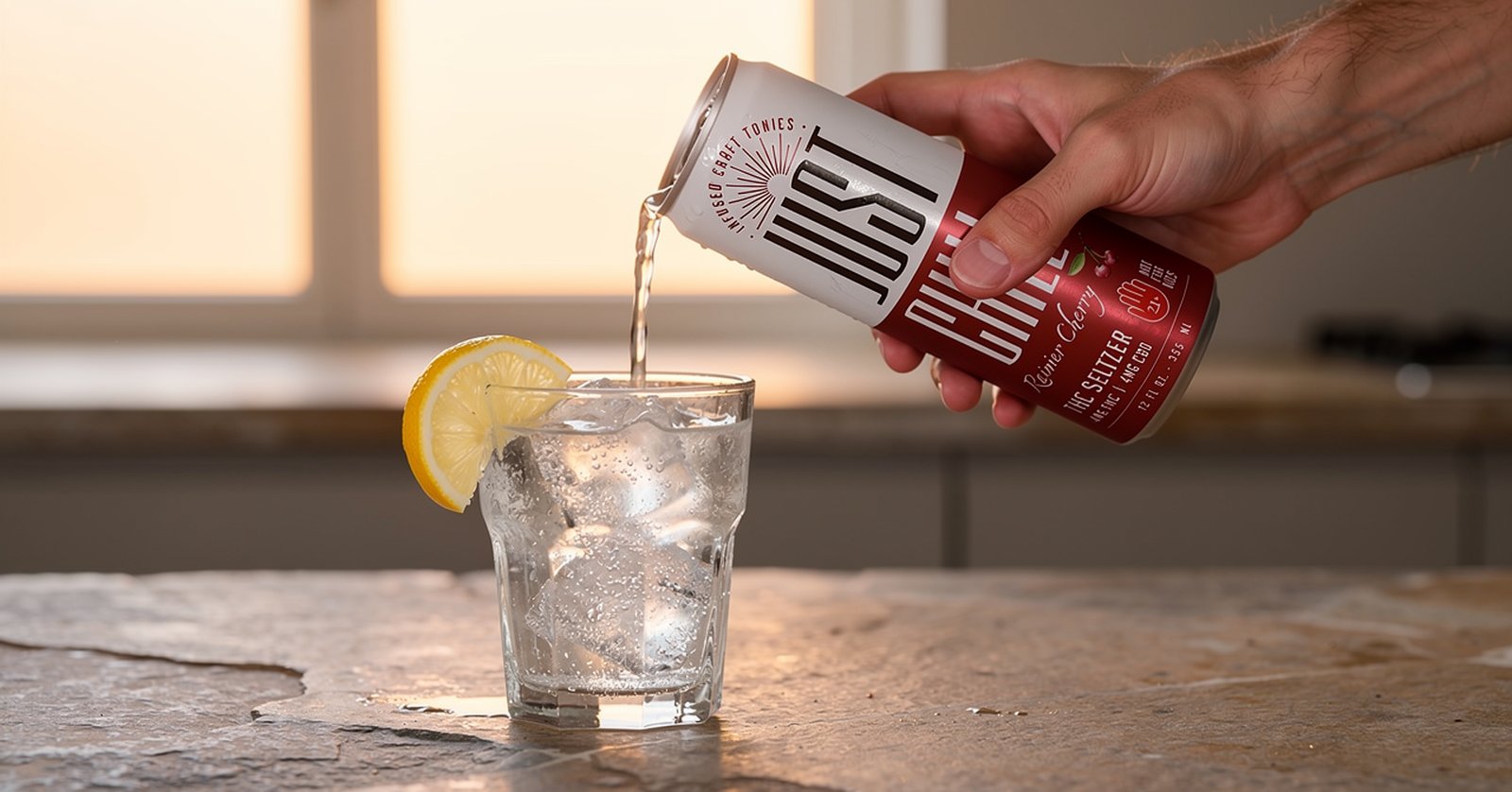 Just Chill Rainier Cherry being poured into a glass of ice with lemon